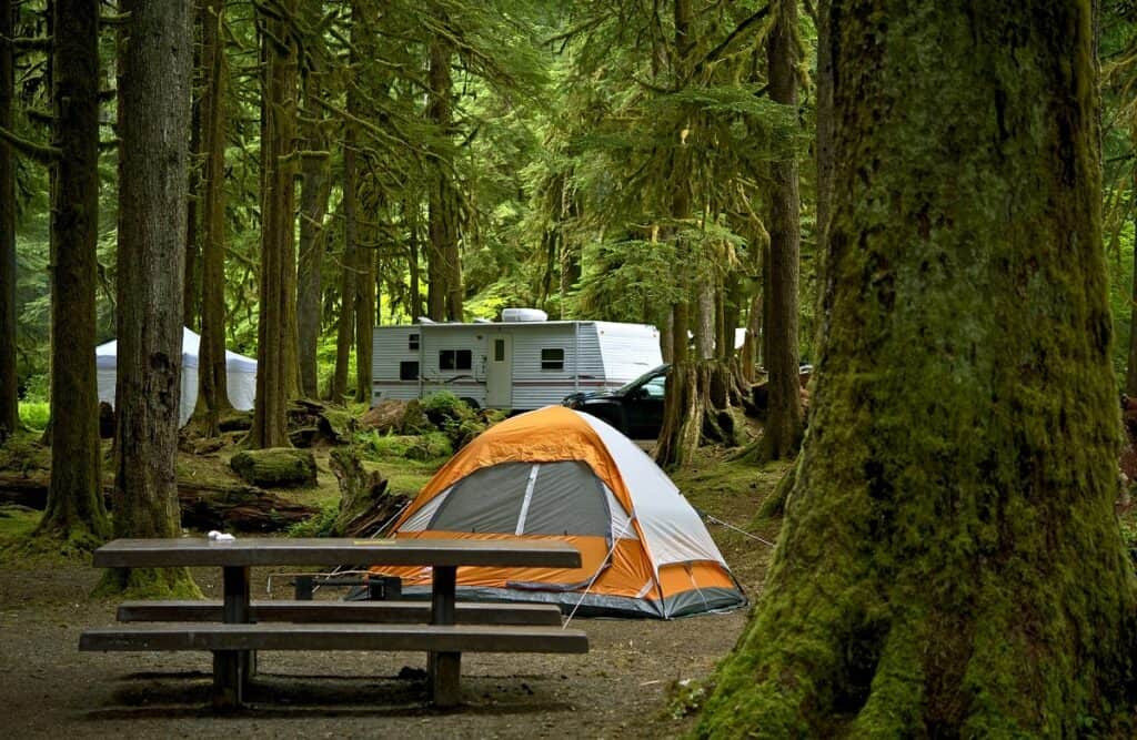 A campground with a tent set up.